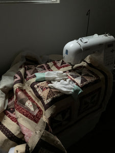 Sewing Machine Waiting for me with a pin wheel quilt under the needle