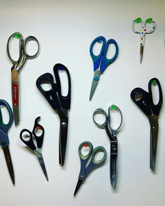 Scissors hung on the wall