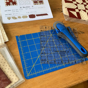 Working with WIPs. My Workspace with a rotary cutter, ruler and cutting mat