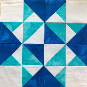Wild Geese Quilt Block Tutorial - quilt block in blue, teal, and white