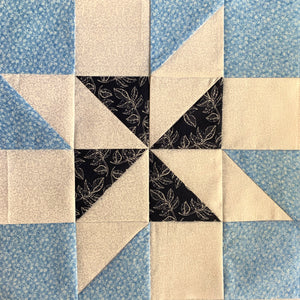 Meteor Quilt Block Free Tutorial - quilt block in light blue, blue, and white. 