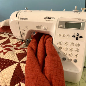 Brother Innovis 80 sewing machine loaded with a quilt ready to be sewn on. Talking about the different parts of a sewing machine.