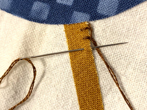Button Hole stitch by hand on a chicken applique