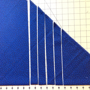 Blue fabric cut on the bias to make bias tape