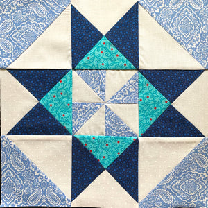 Grandma's Pinwheel Quilt Block in blue, white, and teal