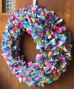 Spring colored scrap fabric circle wreath in pink, teal, purple, and yellow