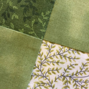 Matching Seams and Points on a Quilt shown using green quilt squares