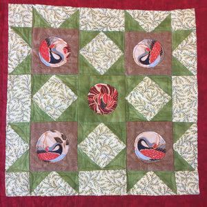 Fussy Cut Blocks on a quilt square with cranes fussy cut into circles