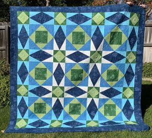 Tsunami Quilt in Navy blue, blue, green, and white