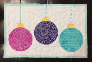 The second holiday ornament table runner in pink, purple, teal, shaped like Christmas Tree Ornaments