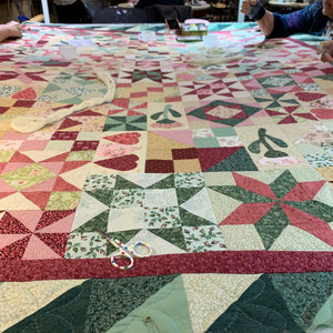 Quilting with the Quilt Days group - Quilt on a frame in pink, green, tan and white
