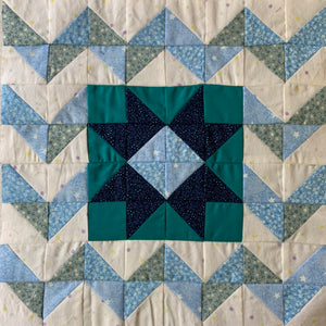 Windy Night Quilt Block in white, teal, and blue