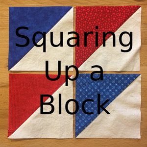 Squaring up a quilting block using half square triangles in red white and blue