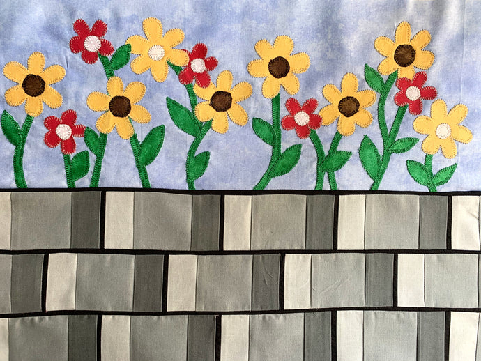Sunflowers on a brick wall quilt row or quilt block