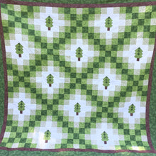 Close up view of Irish woodland quilt for pattern in green and brown