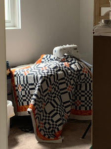 Color Seeds quilt being quilted